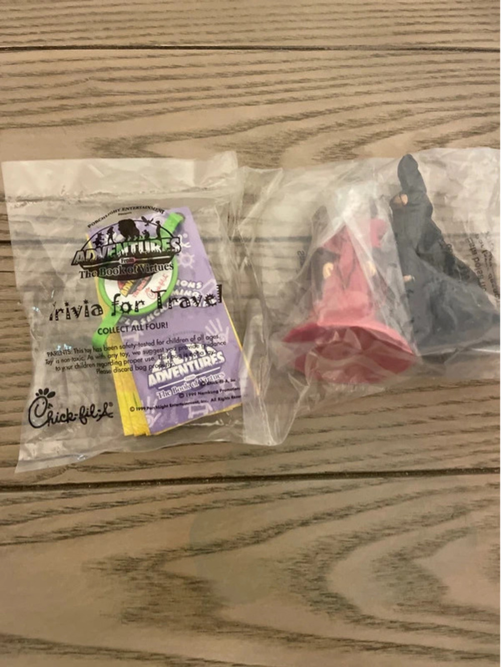 One is a chick fil a toy 1999